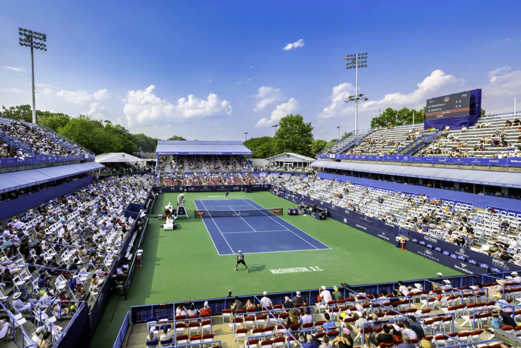 Tennis court and guests watching a match